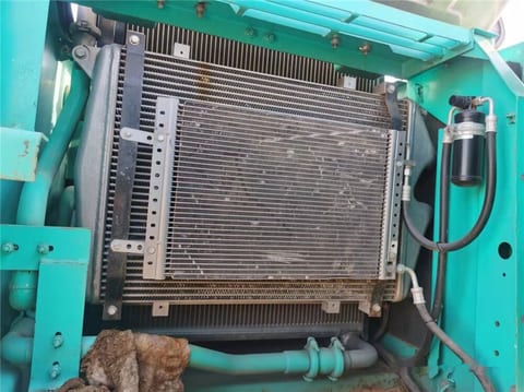 Kobelco SK210 crawler excavator engine compartment radiator view Kobelco SK210 crawler excavator engine compartment radiator view