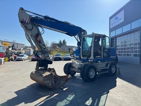 2015 Caterpillar M313D wheel excavator, side profile view 2015 Caterpillar M313D wheel excavator, side profile view