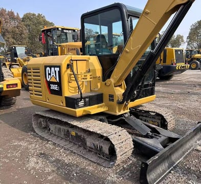 Caterpillar 306E2 mini excavator, side view Caterpillar 306E2 mini excavator, side view