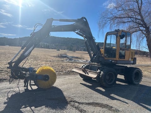 1999 Volvo EB706 excavator, side view with rotary brush attachment 1999 Volvo EB706 excavator, side view with rotary brush attachment