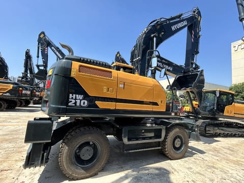 2026 Hyundai HW210 wheel excavator, rear three-quarter view 2026 Hyundai HW210 wheel excavator, rear three-quarter view