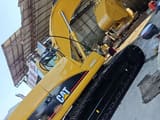 Escavadora de rastos Caterpillar 320C de 2010, vista lateral