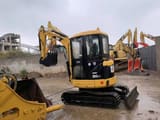 Caterpillar 303CR mini excavator, front three-quarter view
