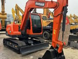 Doosan DX75-9C crawler excavator, front three-quarter view