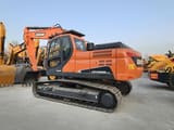 2024 Doosan DX225LCA crawler excavator, rear three-quarter view