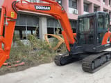 Doosan DX60-9C mini excavator, side view