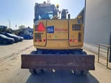 2023 Komatsu PW98MR-11E0 wheel excavator, rear view