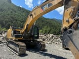 2012 Caterpillar 336E crawler excavator, rear three-quarter view
