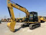 2023 Caterpillar 312D2 GC crawler excavator, front three-quarter view