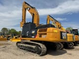 2022 Caterpillar 330D2 excavator, rear three-quarter view