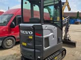 2021 Volvo EC18E mini excavator, rear three-quarter view