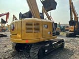 2022 Caterpillar 307E mini excavator rear three-quarter view