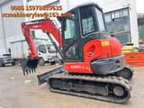 2023 Kubota KX057-4 mini excavator, side view