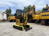 2023 Caterpillar 302CR mini excavator, front three-quarter view