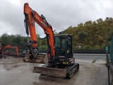 2023 Develon DX50Z-7 mini excavator, front three-quarter view