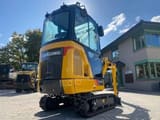 2025 LiuGong 9018 F Mini Excavator from a low front angle, emphasizing the undercarriage and tracks.