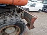 1990 Atlas 1604K wheel excavator rear view with dozer blade