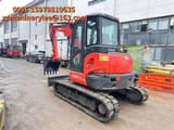 2023 Kubota KX057-4 mini excavator, rear three-quarter view