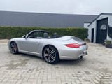 2009 Porsche 997.2 4S convertible, rear three-quarter view