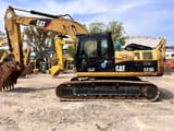 Caterpillar 323D crawler excavator, side profile view