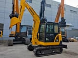 2022 Komatsu PC56 crawler excavator, front three-quarter view