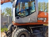 2006 Atlas 1305 M wheel excavator side view