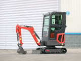 2025 Müller Machinery MB 16-VKSH Mini Excavator with its red boom and arm positioned to the front, revealing the dozer blade.