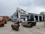 2010 Caterpillar M316D wheel excavator, front three-quarter view