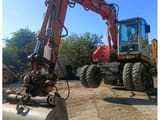 2006 Atlas 1305 wheel excavator, front three-quarter view