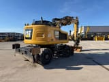 2019 Caterpillar M315F wheel excavator, rear three-quarter view