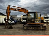2005 Caterpillar 311C crawler excavator, side view