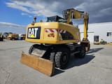 2014 Caterpillar M315D wheel excavator, rear three-quarter view