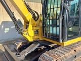 2019 Caterpillar 308E2CR crawler excavator, side view of cab and blade