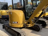 Caterpillar 303.5E mini excavator, rear three-quarter view