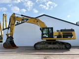 2010 Caterpillar 345DL crawler excavator, side profile view