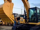 2021 Caterpillar 320 crawler excavator, side view of cab and bucket