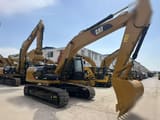 2009 Caterpillar 323DL crawler excavator, side view