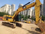 2023 Caterpillar 320GC crawler excavator, rear three-quarter view