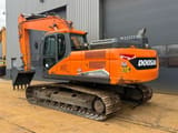 2022 Doosan DX225LC-7 crawler excavator, rear three-quarter view