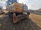 2008 Caterpillar M318D material handler rear view
