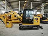Caterpillar 307E2 mini excavator, side view