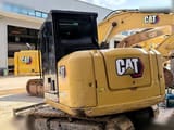 2022 Caterpillar 305.5E2 mini excavator, rear three-quarter view