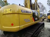 2023 Caterpillar 323D crawler excavator, rear three-quarter view