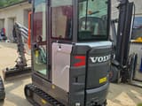 2021 Volvo EC18E mini excavator, rear three-quarter view