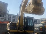 2016 Caterpillar 325C crawler excavator, front three-quarter view