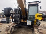 2017 Caterpillar 325FL crawler excavator front view with drilling attachment