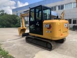 2022 Caterpillar 305.5E2 mini excavator, rear three-quarter view