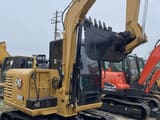 2023 Caterpillar 306E2 mini excavator, rear three-quarter view