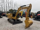 2023 Caterpillar 306E2 mini excavator, rear three-quarter view