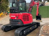 2024 Yanmar VIO55-6B mini excavator, rear three-quarter view